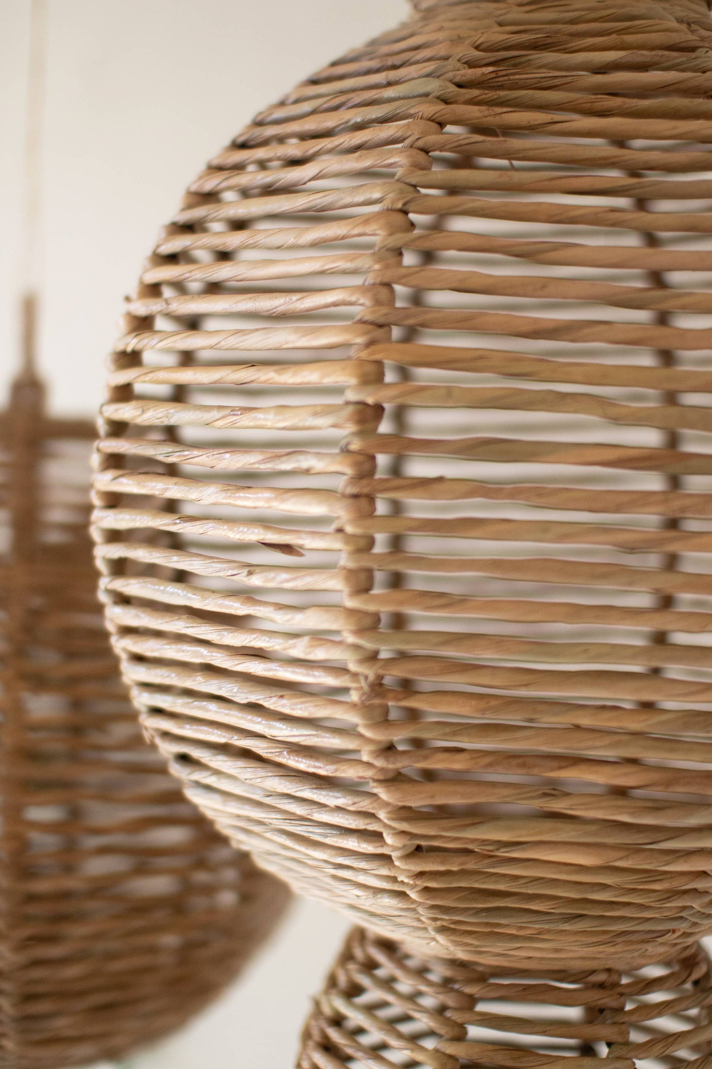 WOVEN SEAGRASS AND IRON ORNAMENTS