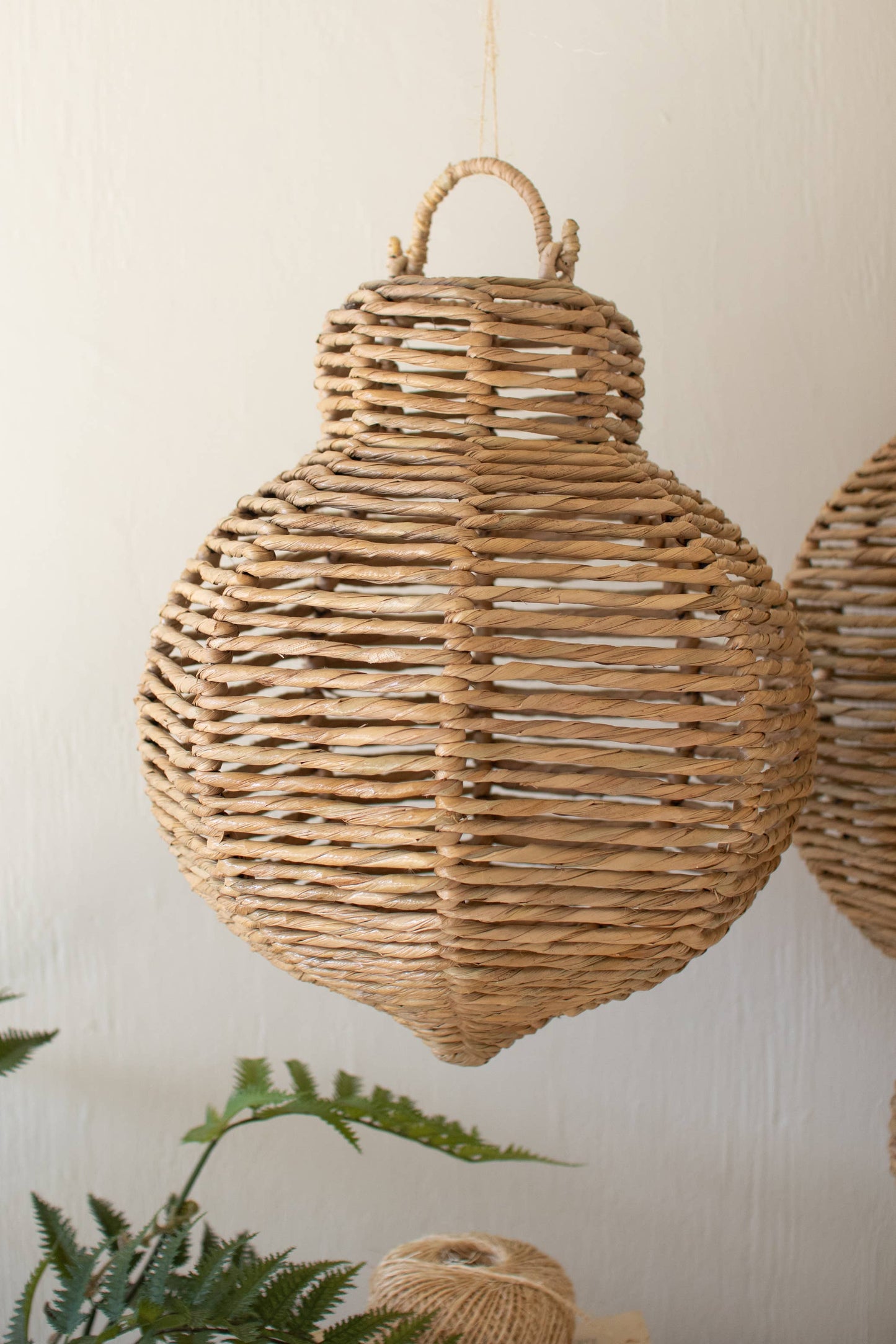 WOVEN SEAGRASS AND IRON ORNAMENTS